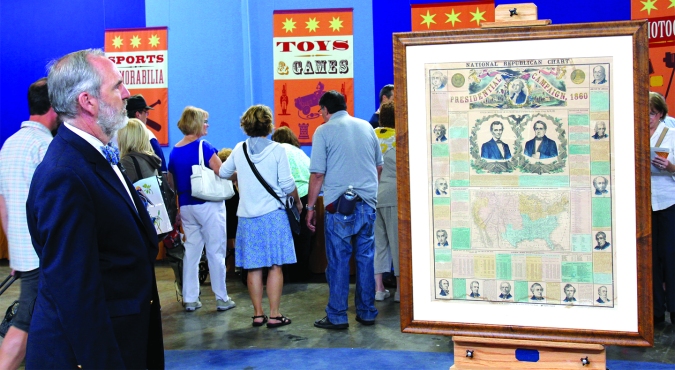 Appraiser Christopher Lane of Philadelphia Print Shop absorbs early American history as presented on a rare poster he was about to appraise at the Chicago Antiques Roadshow on July 26. 