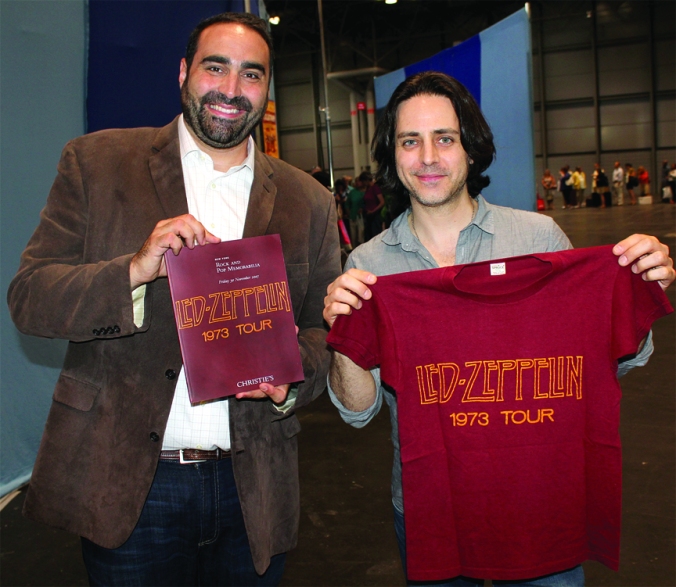Appraiser Simeon Lipman (left) and Jason Sprinzen display the same Led Zeppelin T-shirt that once graced the cover of a Christie's catalog. Sprinzen bought the T from Christie's — and Lipman once worked in the Collectibles department at Christie's.